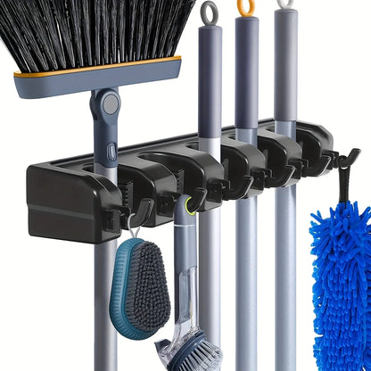Wall-mounted broom holder