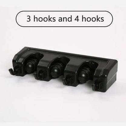 Wall-mounted broom holder