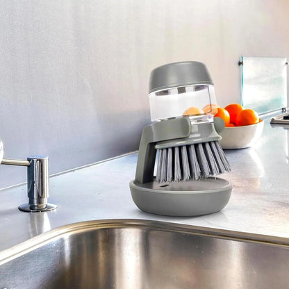 Dish brush with integrated soap dispenser